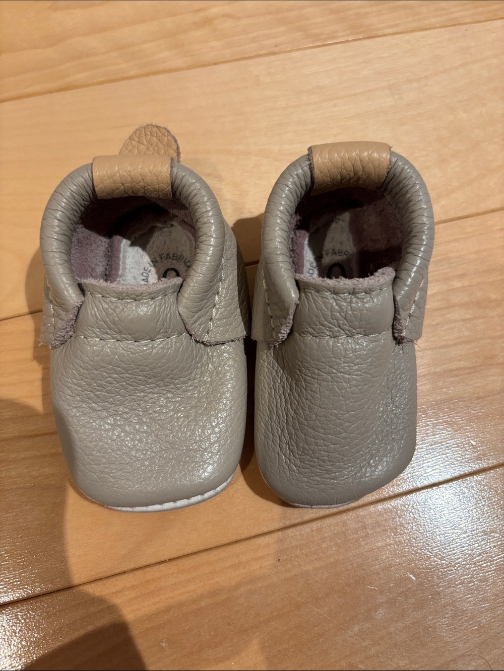 Heyfolks size 0 Soft Leather Baby Moccasins in Taupe with Tan Heel Tab